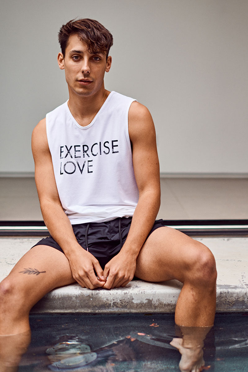 EYSOM Standard Muscle Tee in White with Rainbow Foil on Model Tilted View